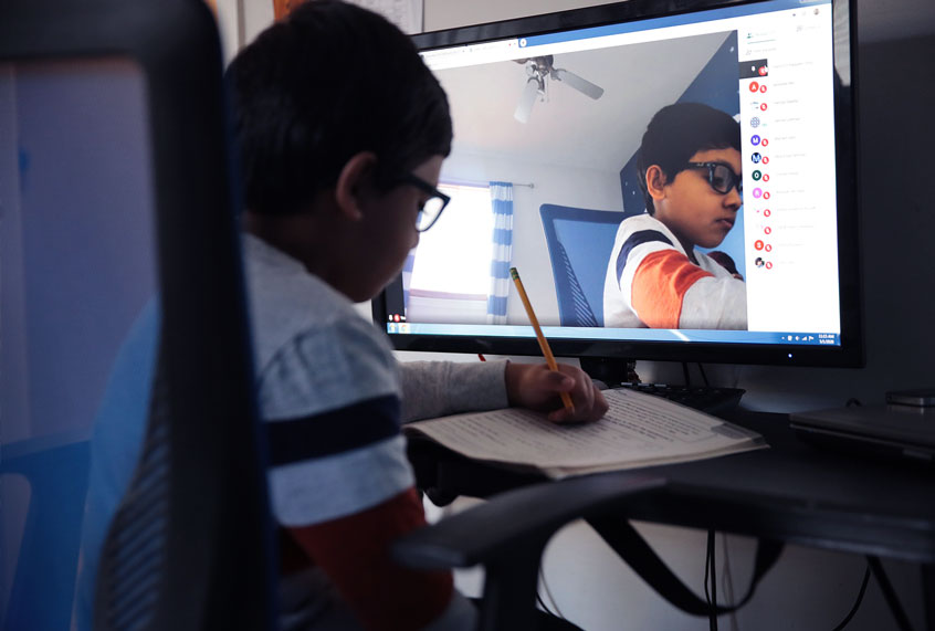 Students have had to adopt an E-learning program to finish the school year after all schools in the state were forced to cancel classes in an attempt to curtail the spread of the COVID-19 pandemic. (Scott Olson/Getty)