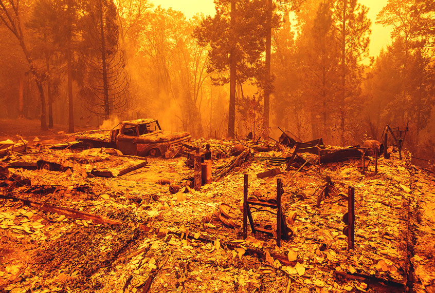 A burned residence smolders during the Bear fire, part of the North Lightning Complex fires, in unincorporated Butte County, California on September 09, 2020. (JOSH EDELSON/AFP via Getty Images)