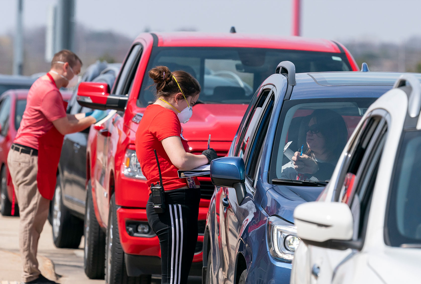 Poll workers take ballots during curbside voting on April 7, 2020 in Sun Prairie, Wisconsin. Residents in Wisconsin went to the polls a day after the U.S. Supreme Court voted against an extension of the absentee ballot deadline in the state. Because of the coronavirus, the number of polling places was drastically reduced. (Andy Manis/Getty Images)