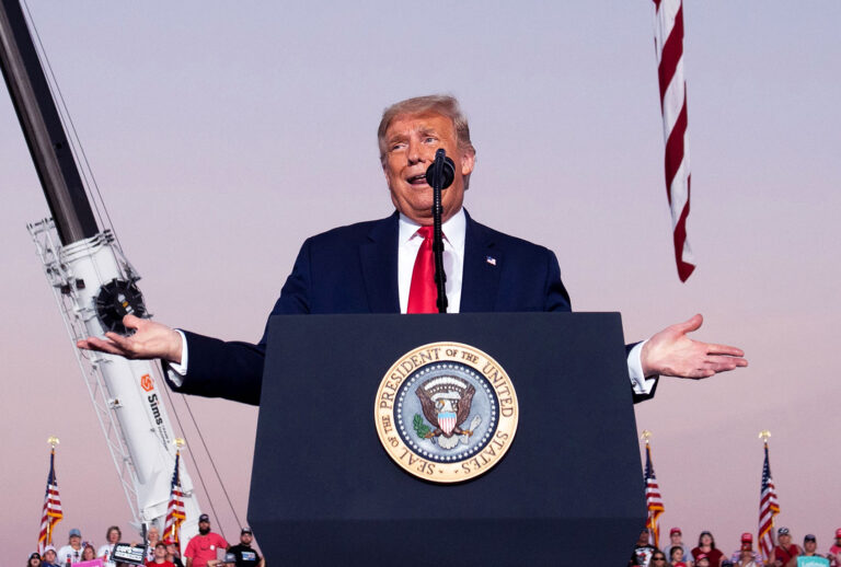 US President Donald Trump holds a Make America Great Again rally as he campaigns at Orlando Sanford International Airport in Sanford, Florida, October 12, 2020. (SAUL LOEB/AFP via Getty Images)
