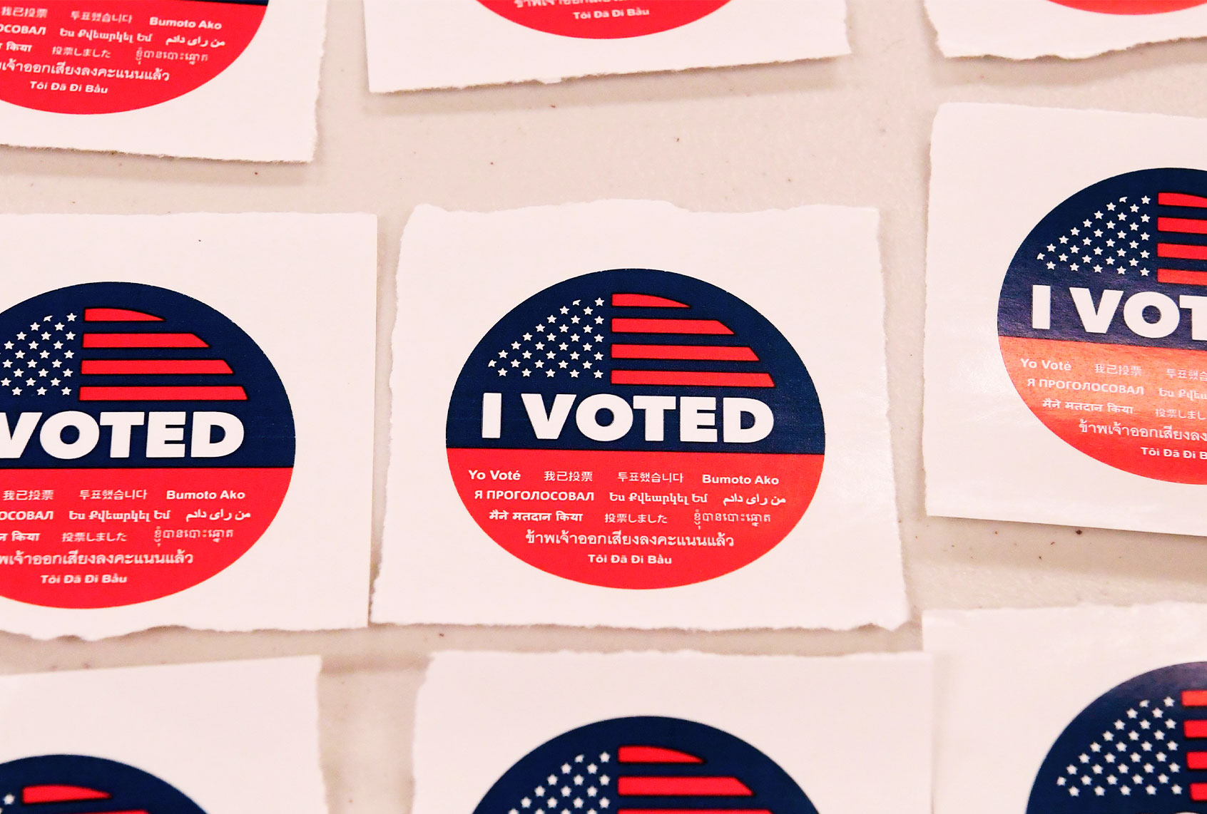 Multi-lingual "I Voted" stickers await voters after they cast their vote in the 2020 US elections at the Los Angeles County Registrar in Norwalk, California on October 19, 2020. - Voter turnout is ten times higher than in 2016 in California according the Secretary of State Alex Padilla as over 600,000 Los Angeles County ballots are already at the county registrar. (FREDERIC J. BROWN/AFP via Getty Images)
