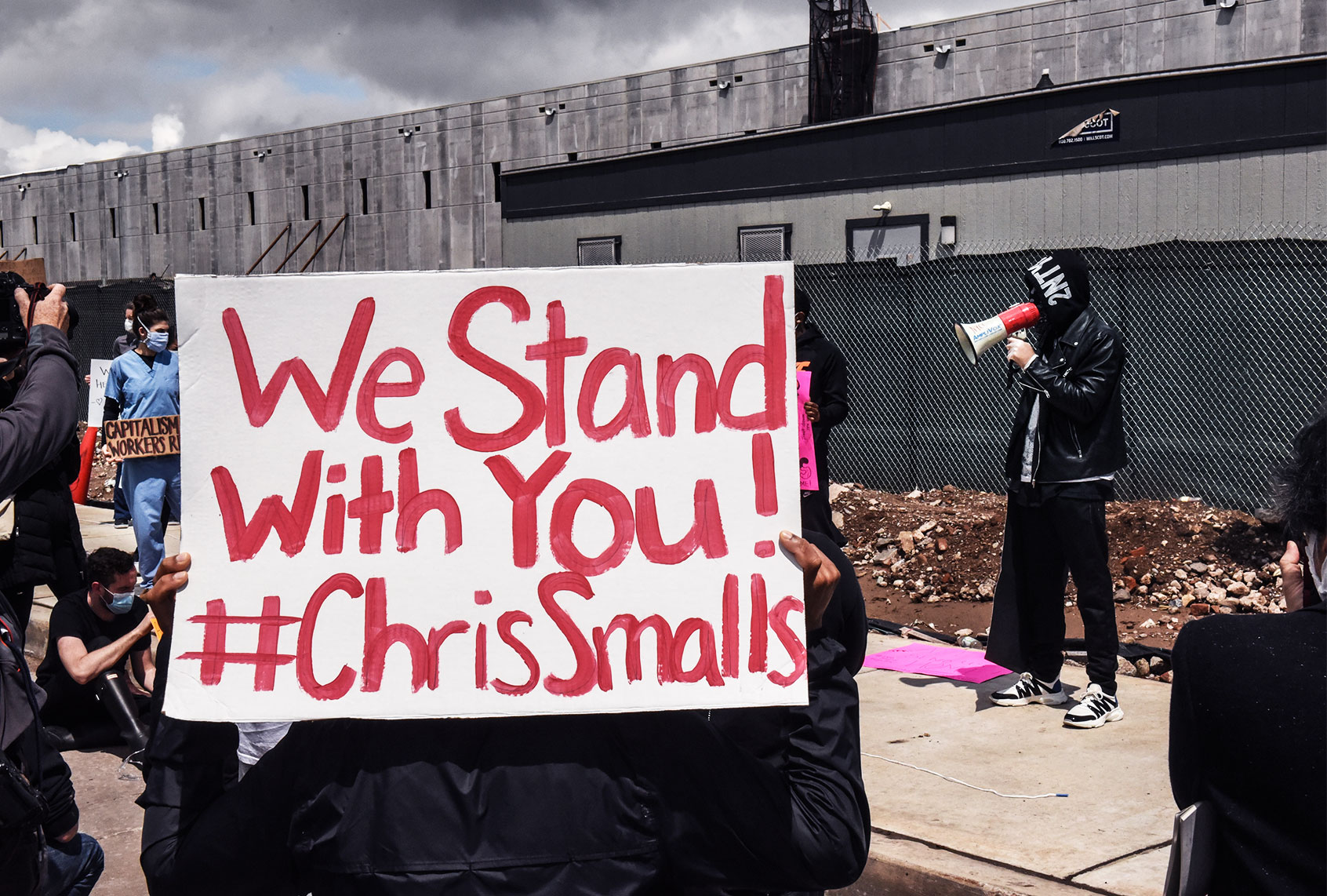 Chris Smalls, a former Amazon employee who was fired in March after staging a small walkout over conditions, speaks during a protest of working conditions outside of an Amazon warehouse fulfillment center on May 1, 2020 in the Staten Island borough of New York City. People attending the protest are concerned about Amazon's handling of the coronavirus and are demanding more safety precautions during the pandemic. (Stephanie Keith/Getty Images)