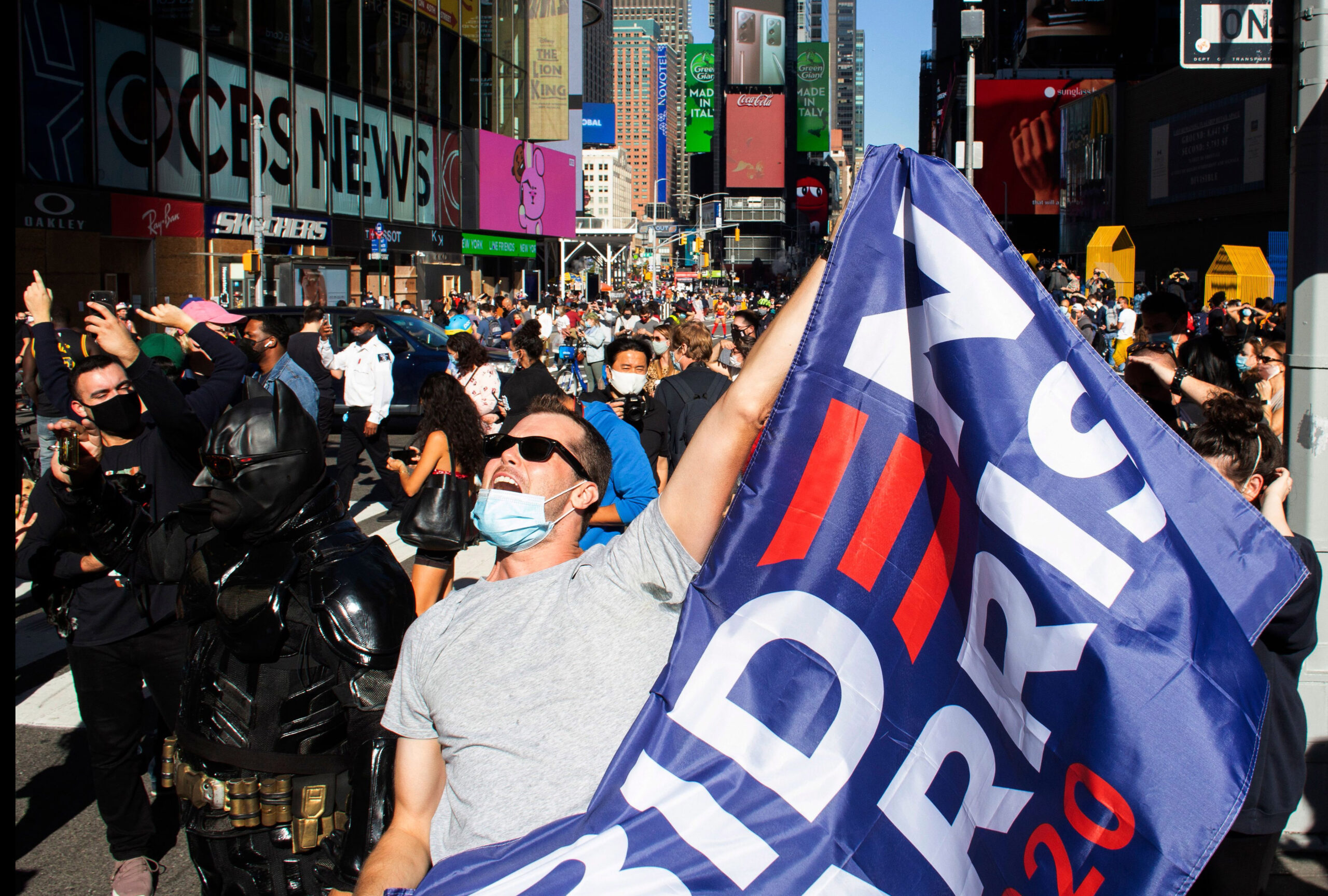 People celebrate at Times Square in New York after Joe Biden was declared winner of the 2020 presidential election on November 7, 2020. (KENA BETANCUR/AFP via Getty Images)