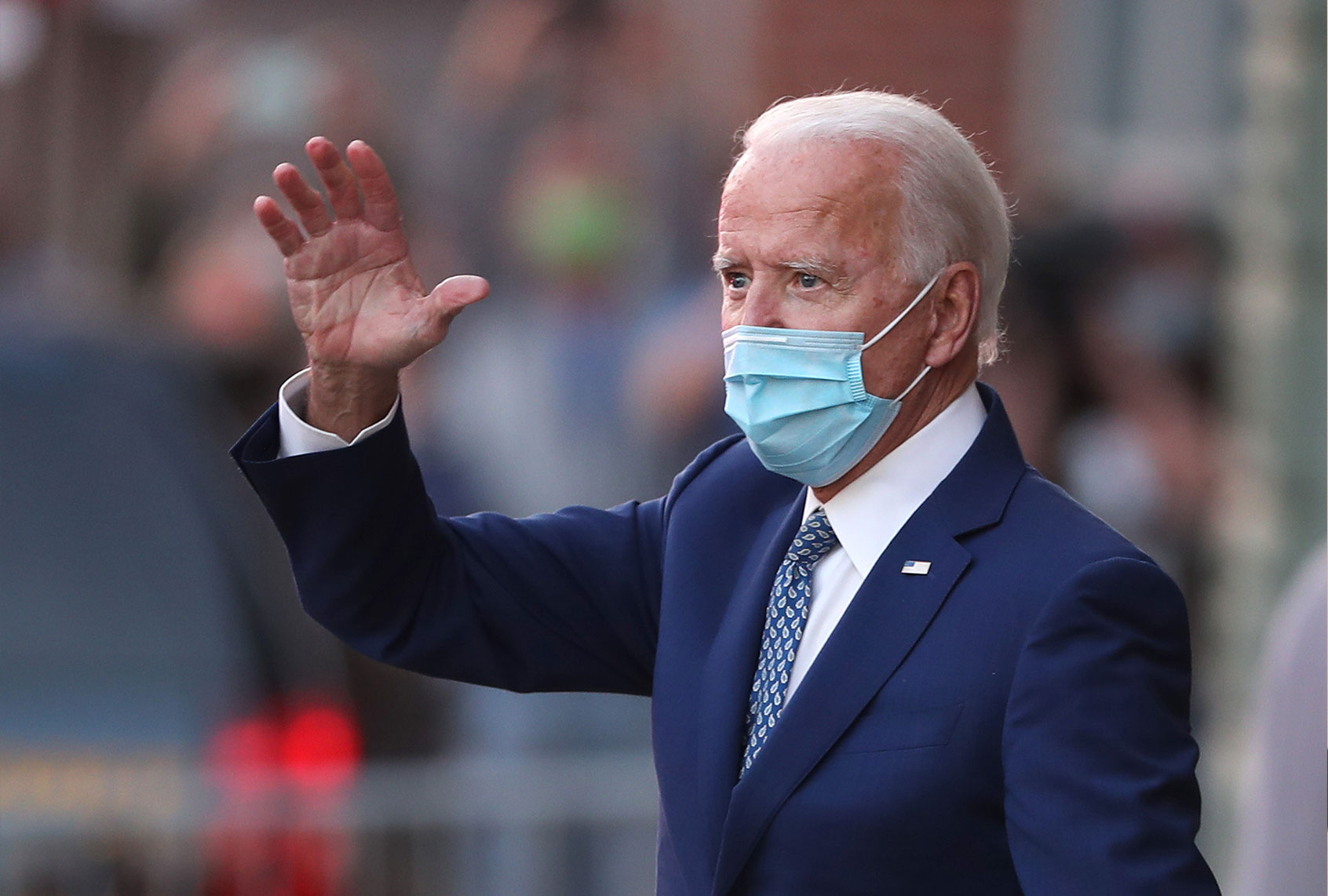 President-elect Joe Biden waves to supporters as he leaves the Queen theater after receiving a briefing from the transition COVID-19 advisory board on November 09, 2020 in Wilmington, Delaware. Mr. Biden addressed the media earlier in the day about his response to the COVID-19 pandemic. (Joe Raedle/Getty Images)
