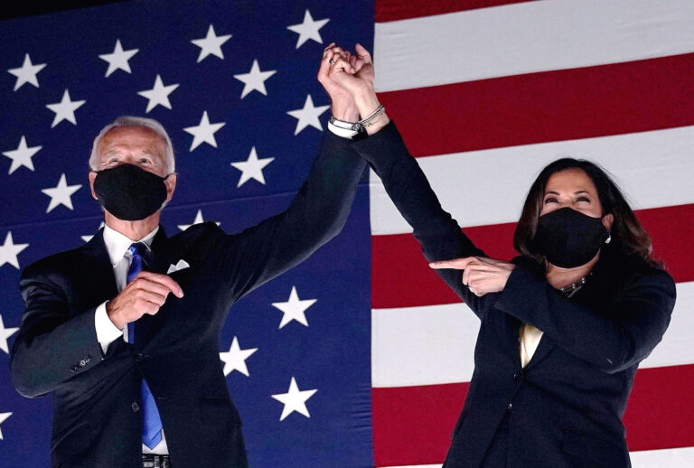 Former vice-president and Democratic presidential nominee Joe Biden (L) and Senator from California and Democratic vice presidential nominee Kamala Harris greet supporters outside the Chase Center in Wilmington, Delaware, at the conclusion of the Democratic National Convention, held virtually amid the novel coronavirus pandemic, on August 20, 2020. (OLIVIER DOULIERY/AFP via Getty Images)