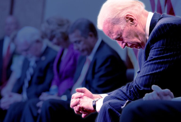 Joe Biden bows his head in prayer (Tom Williams/CQ Roll Call)