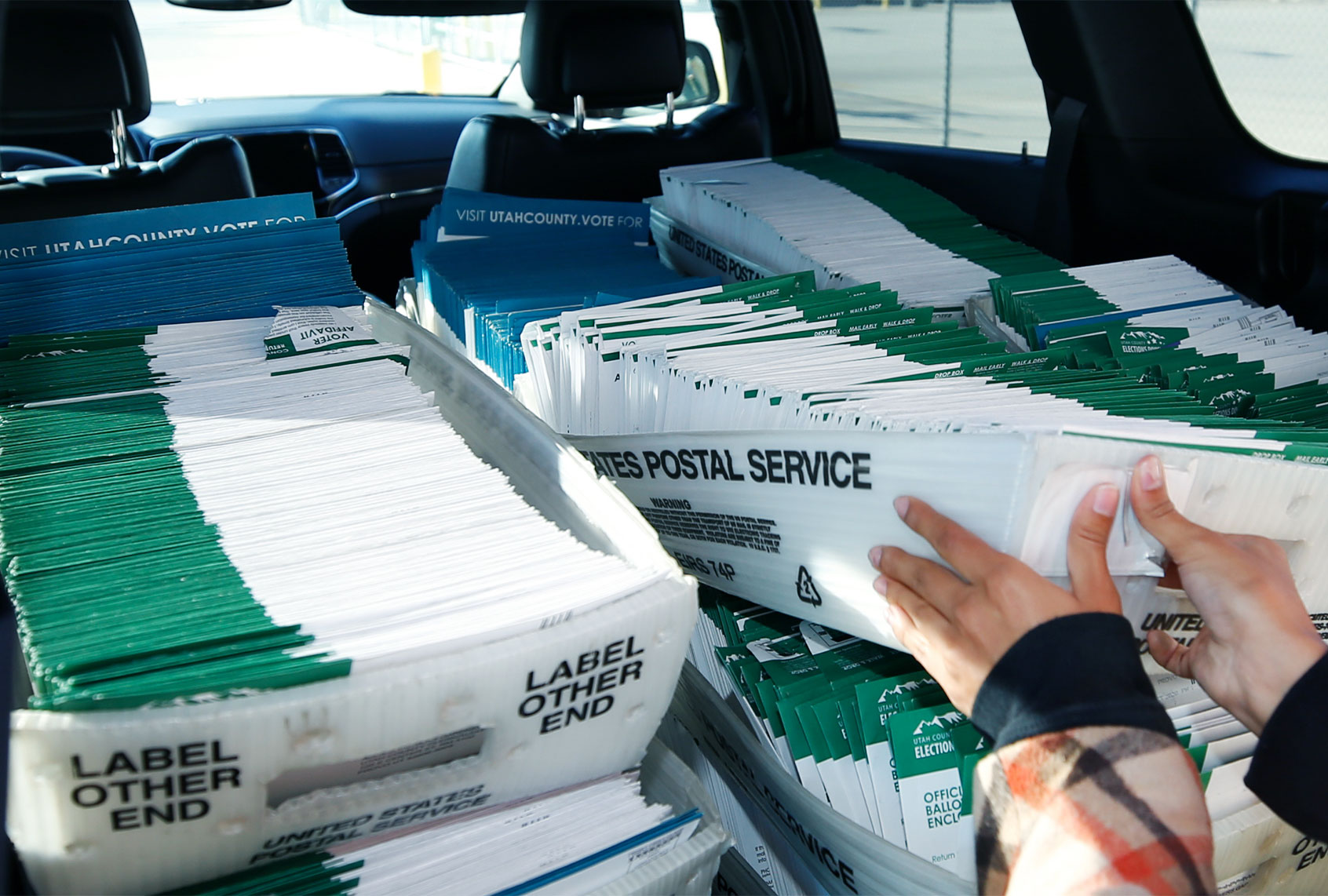 A Utah County Election worker picks up mailed ballots from the United States Postal Service office on October 26, 2020 in Provo, Utah. Utah is one of several states that has recently moved to mail-in ballots for presidential elections. (Photo by (George Frey/Getty Images)