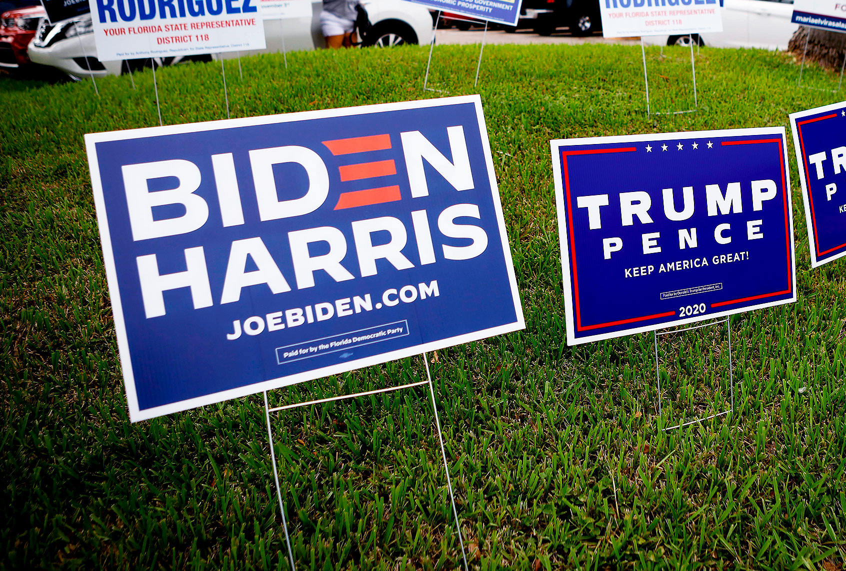 Campaign signs are seen at Westchester Regional Library in Miami, Florida on October 19, 2020. (EVA MARIE UZCATEGUI/AFP via Getty Images)