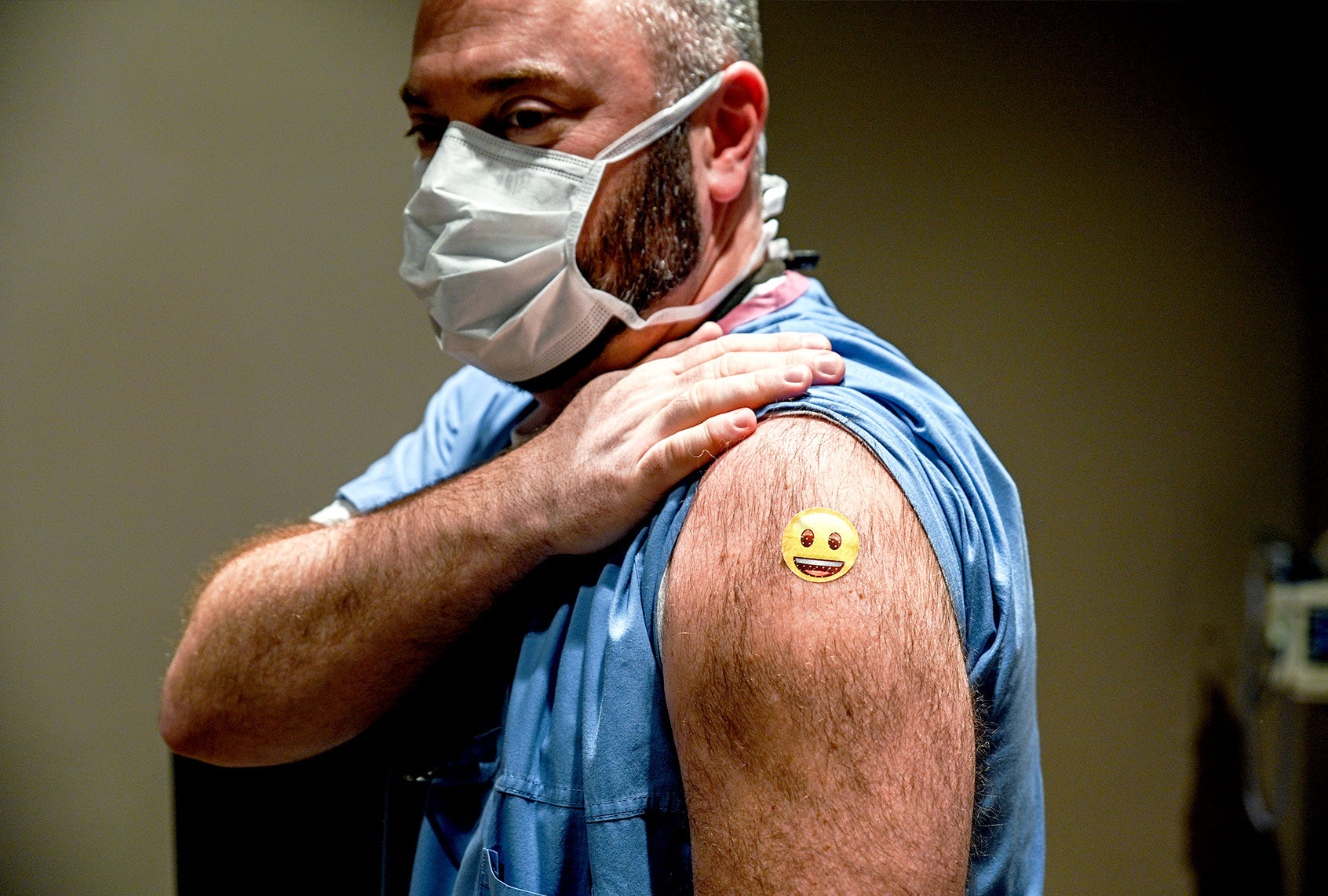 Dr. Jason Smith displays his bandage after being administered a COVID-19 vaccination at University of Louisville Hospital on December 14, 2020 in Louisville, Kentucky. The Pfizer-BioNTech vaccine became available for specified use on Monday morning to five members of hospital staff. Dr. Smith became the first recipient of the vaccine in the state of Kentucky. (Jon Cherry/Getty Images)