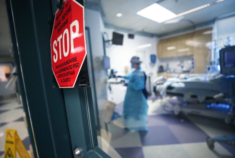 A nurse cares for a coronavirus (COVID-19) patient in the Intensive Care Unit (ICU) at El Centro Regional Medical Center in hard-hit Imperial County on July 28, 2020 in El Centro, California. (Mario Tama/Getty Images)