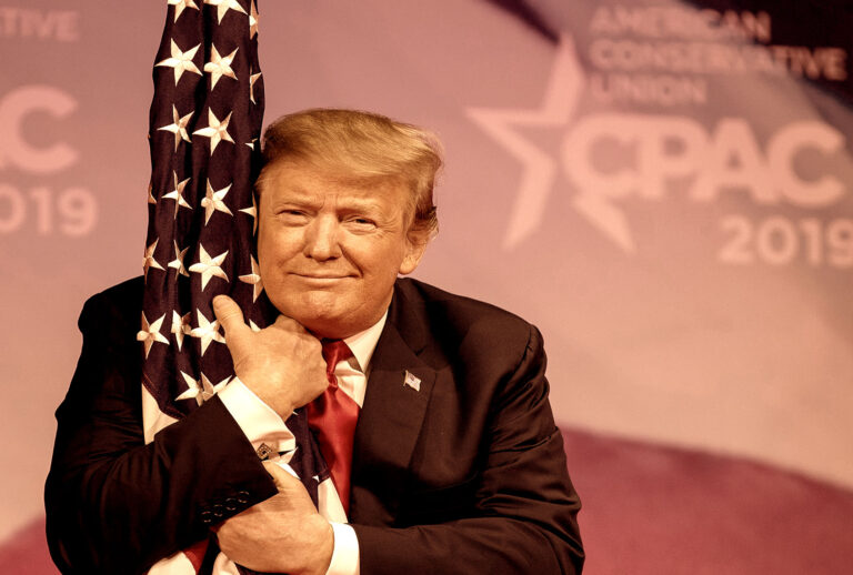 U.S. President Donald Trump hugs the U.S. flag during CPAC 2019 on March 02, 2019 in National Harbor, Maryland. The American Conservative Union hosts the annual Conservative Political Action Conference to discuss conservative agenda. (Tasos Katopodis/Getty Images)