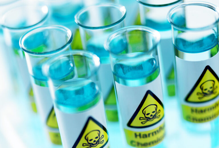 Close up of test tubes with toxic labels (Getty Images)