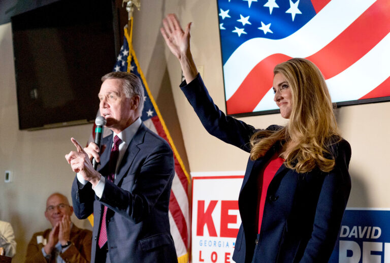 U.S. Sen David Perdue (R-GA) and Sen Kelly Loeffler (R-GA) speaks at a campaign event to supporters at a restaurant on November 13, 2020 in Cumming, Georgia. (Megan Varner/Getty Images)