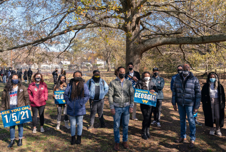 Democratic U.S. Senate candidate Raphael Warnock and former Democratic presidential candidate Julián Castro pose with Latinx organizers at a campaign event on December 8, 2020 in Atlanta, Georgia. Warnock is campaigning in the state ahead of his January 5th runoff election against Sen. Kelly Loeffler (R-GA). (Elijah Nouvelage/Getty Images)