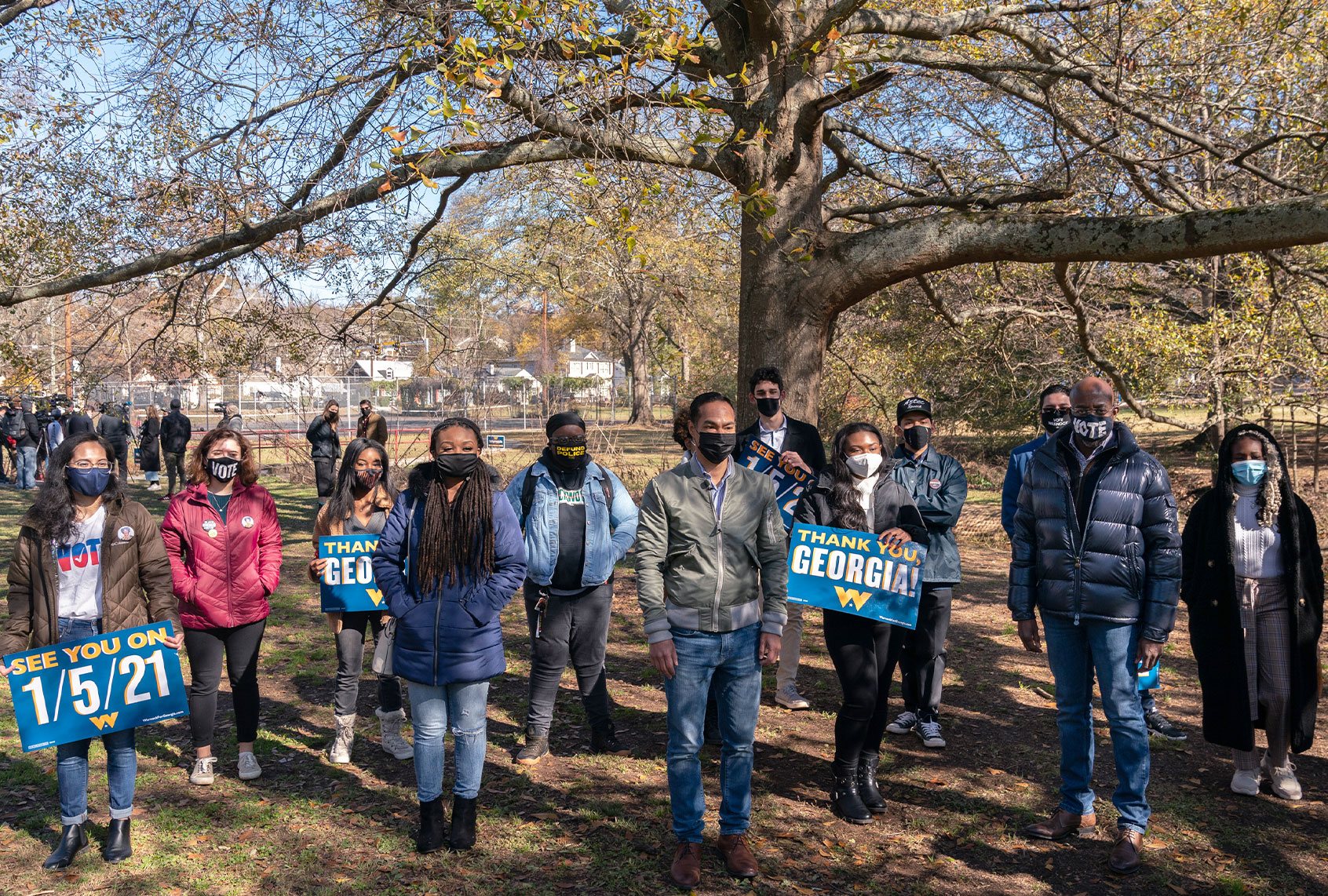 Democratic U.S. Senate candidate Raphael Warnock and former Democratic presidential candidate Julián Castro pose with Latinx organizers at a campaign event on December 8, 2020 in Atlanta, Georgia. Warnock is campaigning in the state ahead of his January 5th runoff election against Sen. Kelly Loeffler (R-GA). (Elijah Nouvelage/Getty Images)