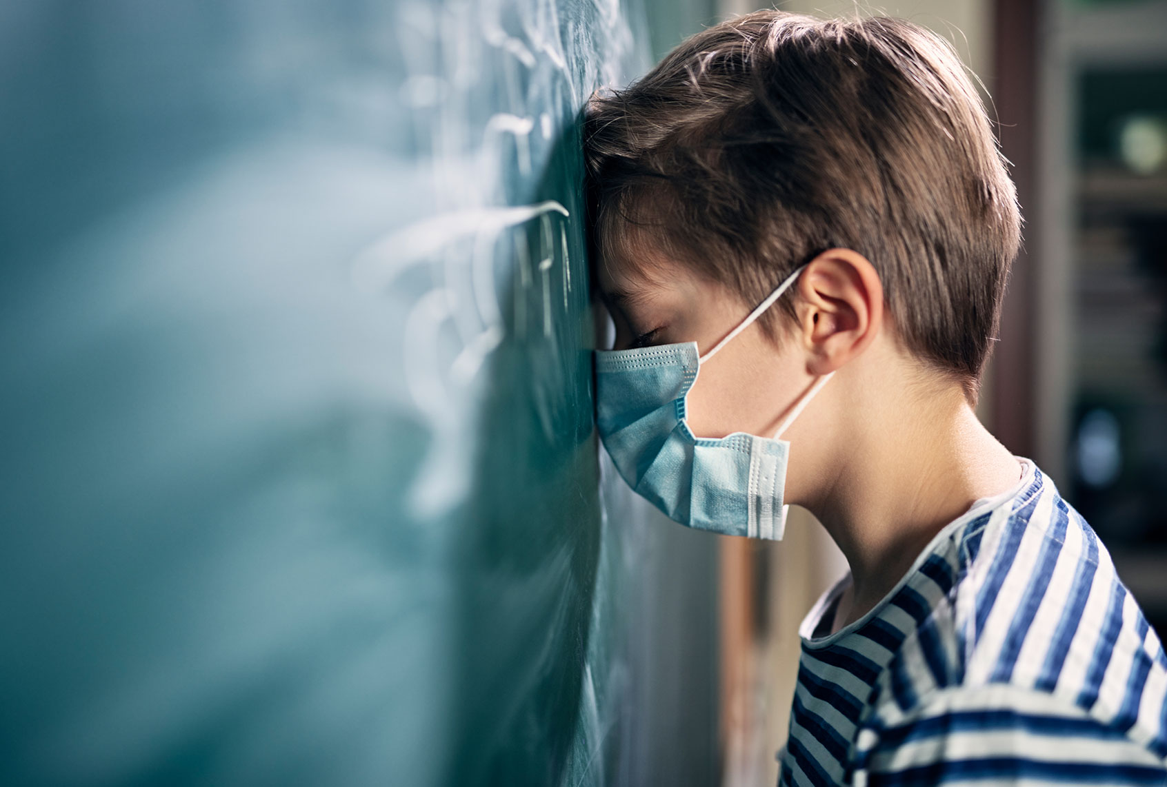 Little boy overwhelmed during the COVID-19 pandemic (Getty Images)
