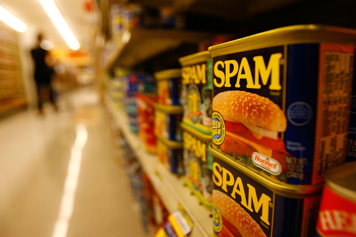 SIERRA MADRE, CA: Spam, the often-maligned classic canned lunch meat made by Hormel Foods, is seen on a grocery store shelf May 29, 2008, in Sierra Madre, Calif. Spam was created in 1937 and was popularized as a staple food for World War II Western allied forces. (Photo by David McNew/Getty Images)