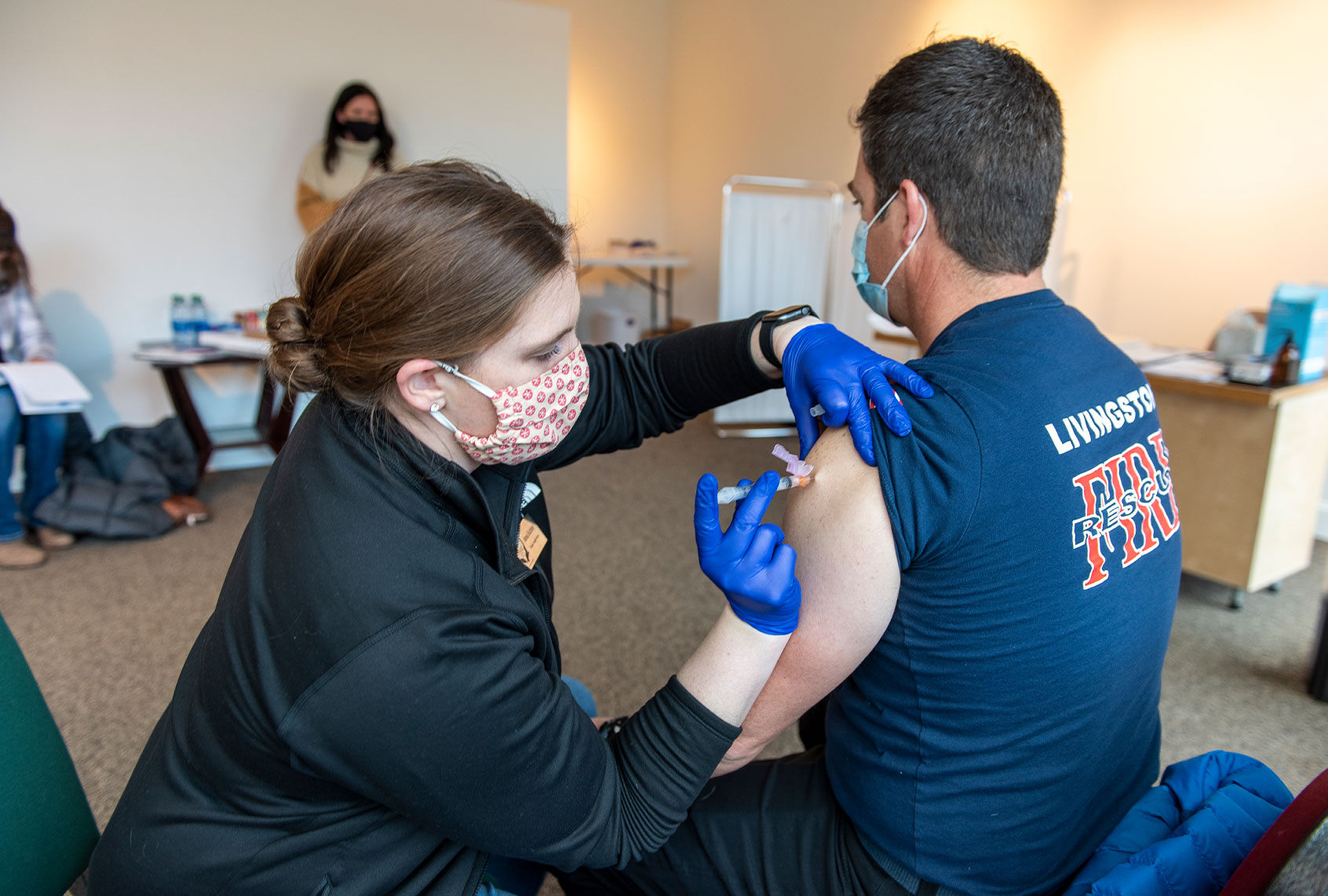 EMT Matt Johnson of Livingston Fire and Rescue receives a Moderna COVID-19 vaccination at the Park County Health Departments storefront clinic on January 5, 2021 in Livingston, Montana. (William Campbell/Getty Images)