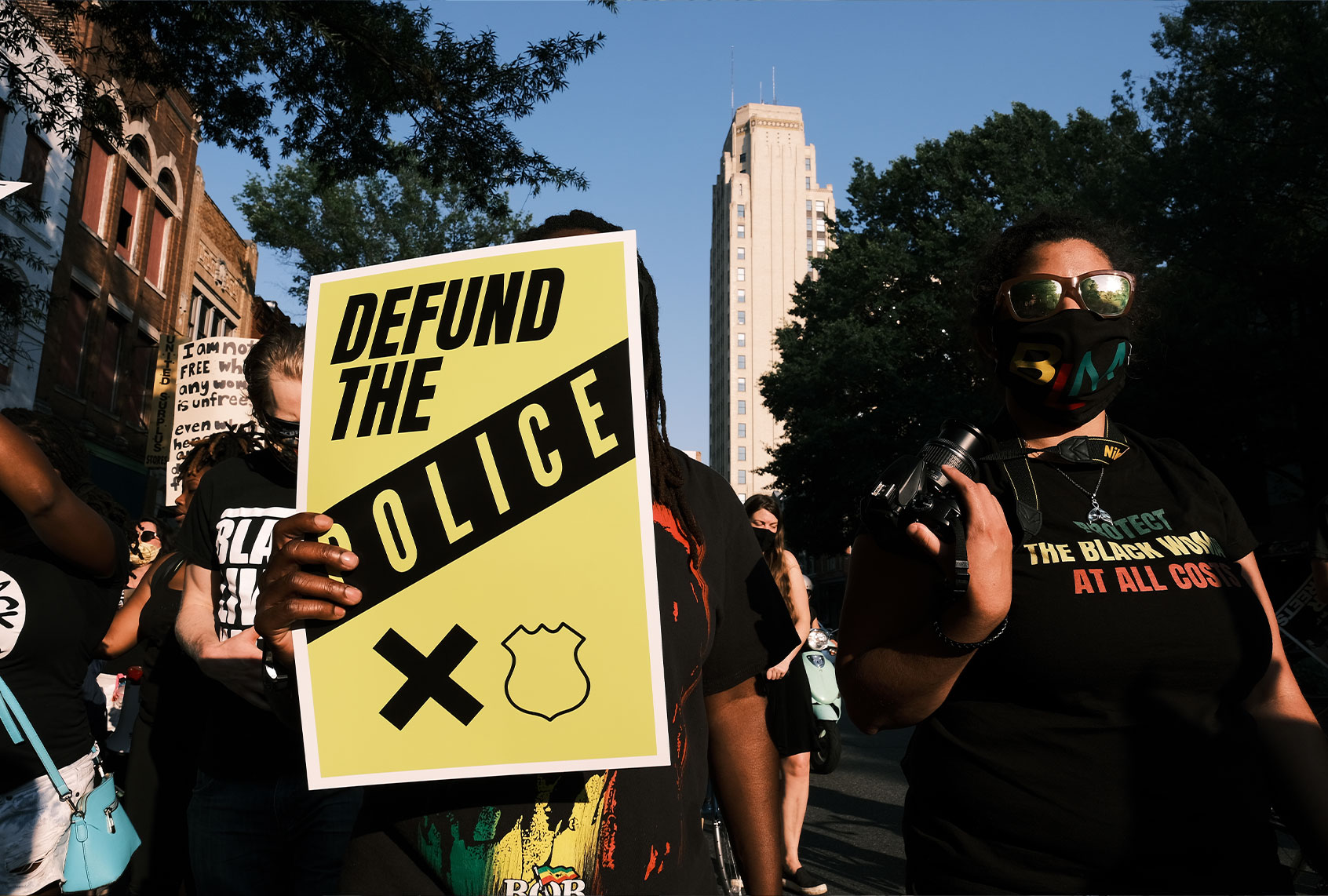 A protester carries a sign that reads "Defund The Police" during the Black Women Matter "Say Her Name" march on July 3, 2020 in Richmond, Virginia. Protests continue around the country after the death of African Americans while in police custody. (Eze Amos/Getty Images)