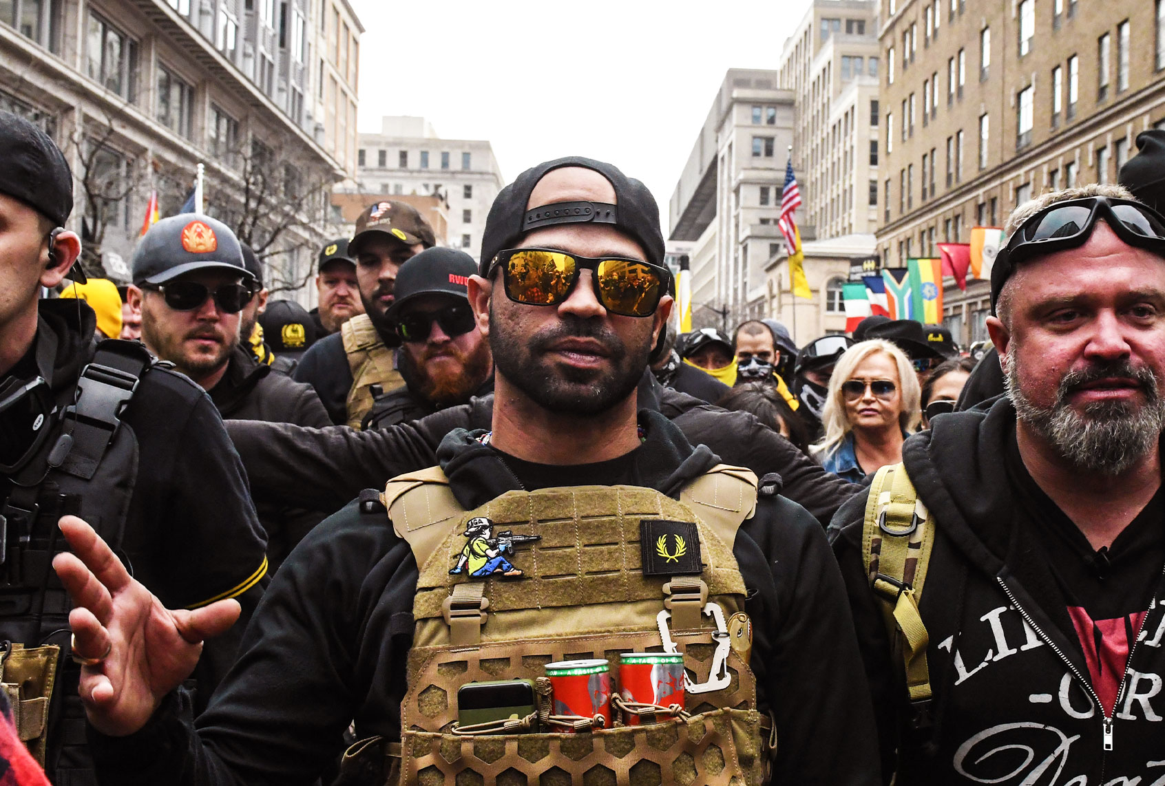 Enrique Tarrio, leader of the Proud Boys (L) and Joe Biggs (R) gather outside of Harry's bar during a protest on December 12, 2020 in Washington, DC. (Stephanie Keith/Getty Images)
