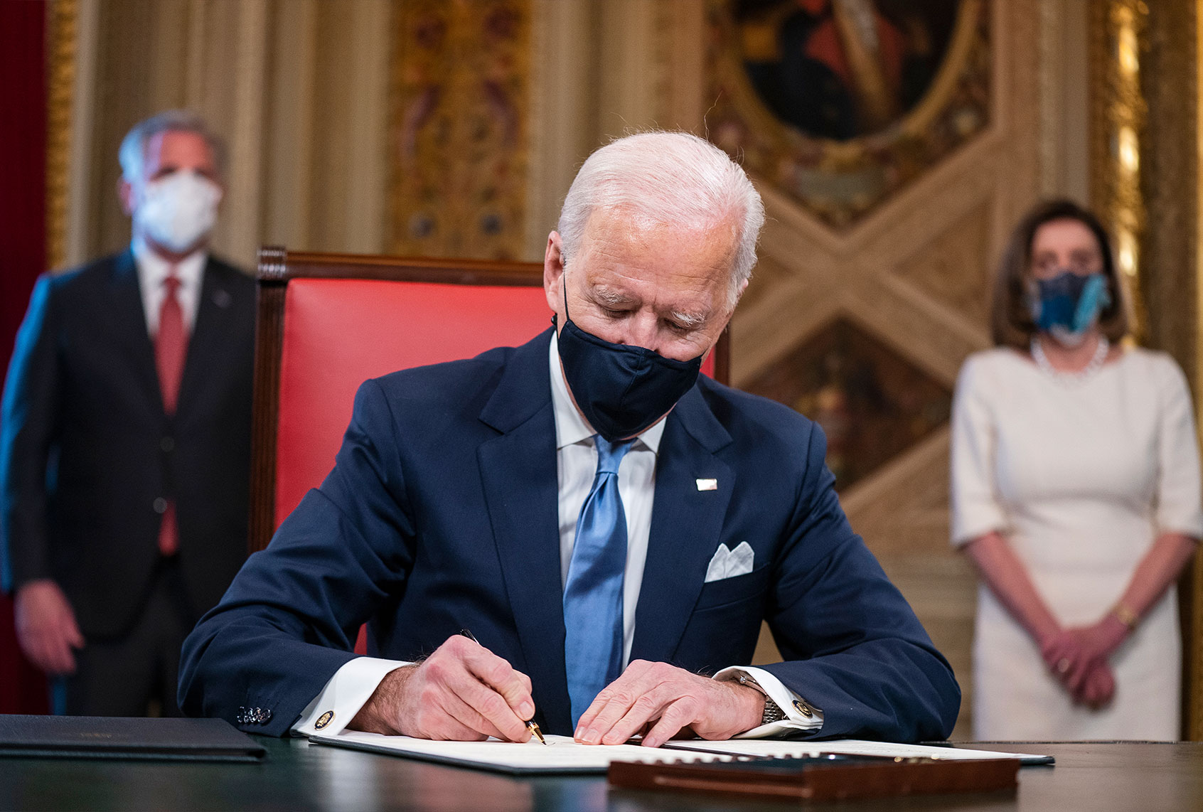 US President Joe Biden signs three documents including an Inauguration declaration, cabinet nominations and sub-cabinet noinations in the Presidents Room at the US Capitol after the inauguration ceremony to making Biden the 46th President of the United States on January 20, 2021 in Washington, DC. During today's inauguration ceremony Joe Biden becomes the 46th president of the United States. (Jim Lo Scalzo-Pool/Getty Images)