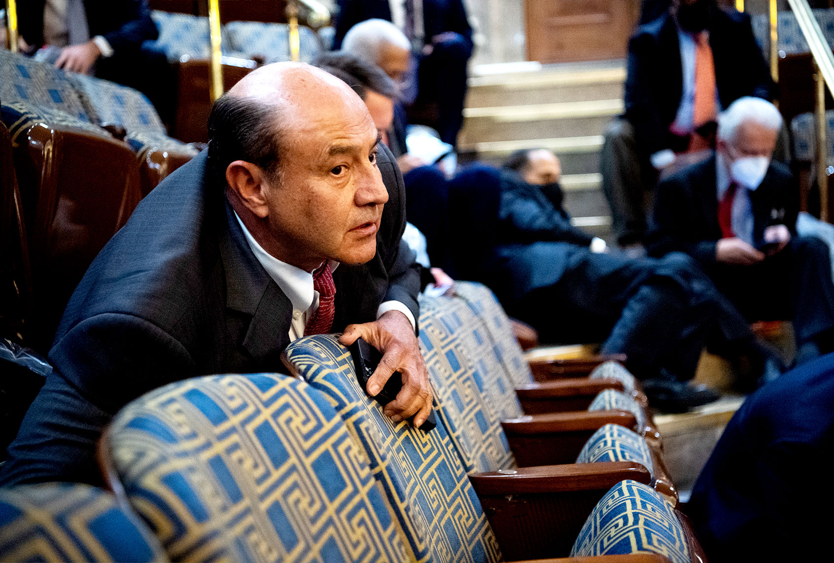 Rep. Lou Correa, D-Calif., and other members take cover as protesters attempt to disrupt the joint session of Congress to certify the Electoral College vote on Wednesday, January 6, 2021. (Tom Williams/CQ-Roll Call, Inc via Getty Images)