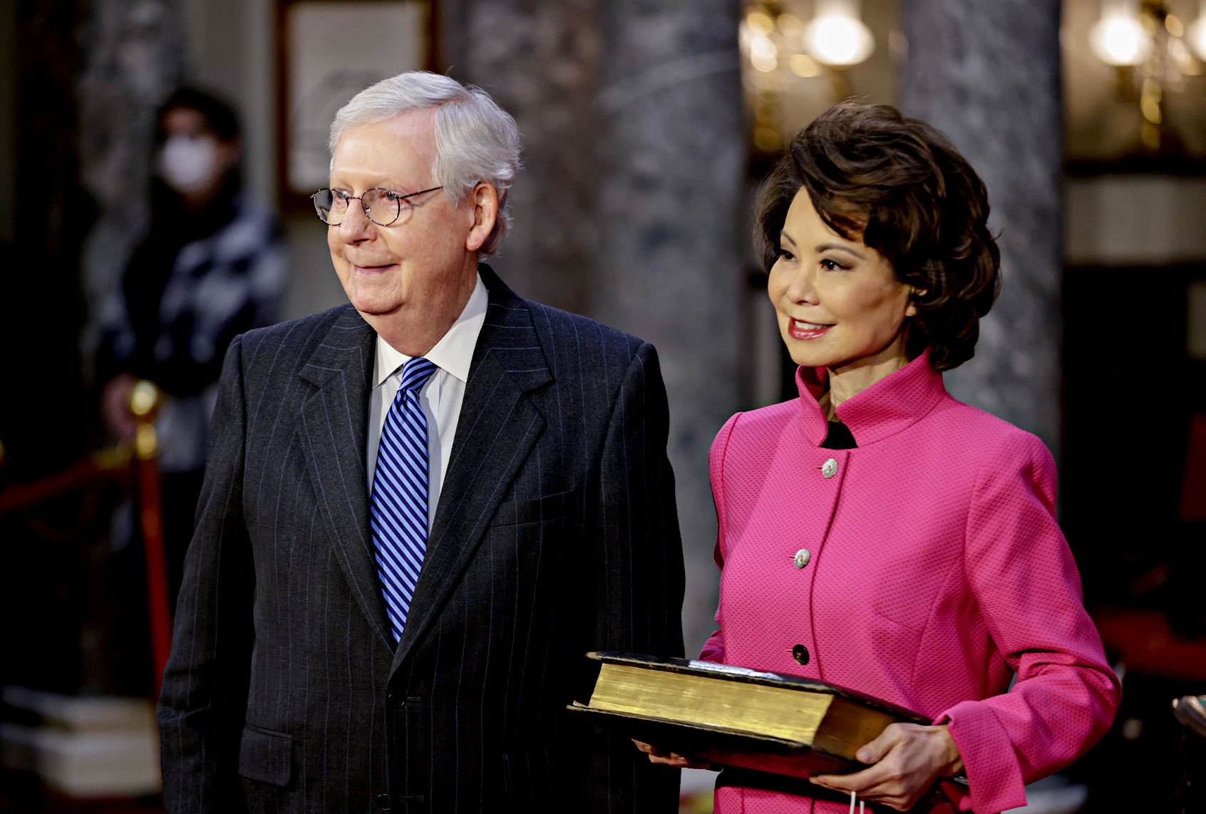 Senate Majority Leader Mitch McConnell (R-KY) waits to be sworn-in with his wife Elaine Chao, U.S. Secretary of Transportation, at the U.S. Capitol on January 3, 2021 in Washington, D.C. (Samuel Corum-Pool/Getty Images)