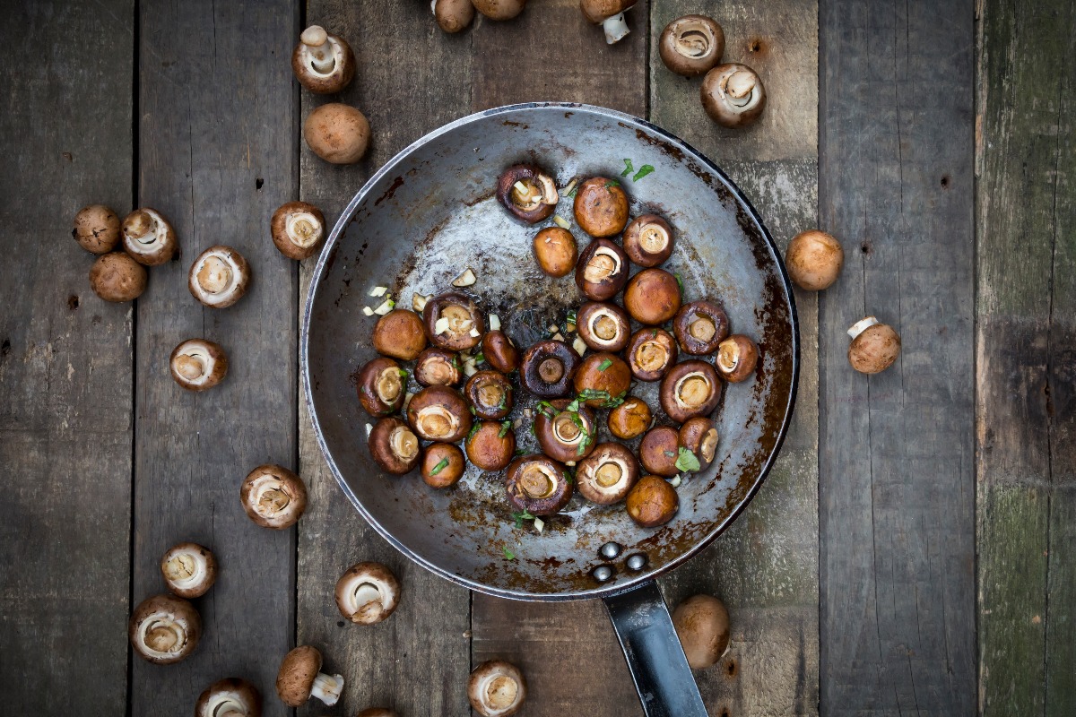 Crimini mushrooms with garlic and basil in pan, braised (Getty Images)
