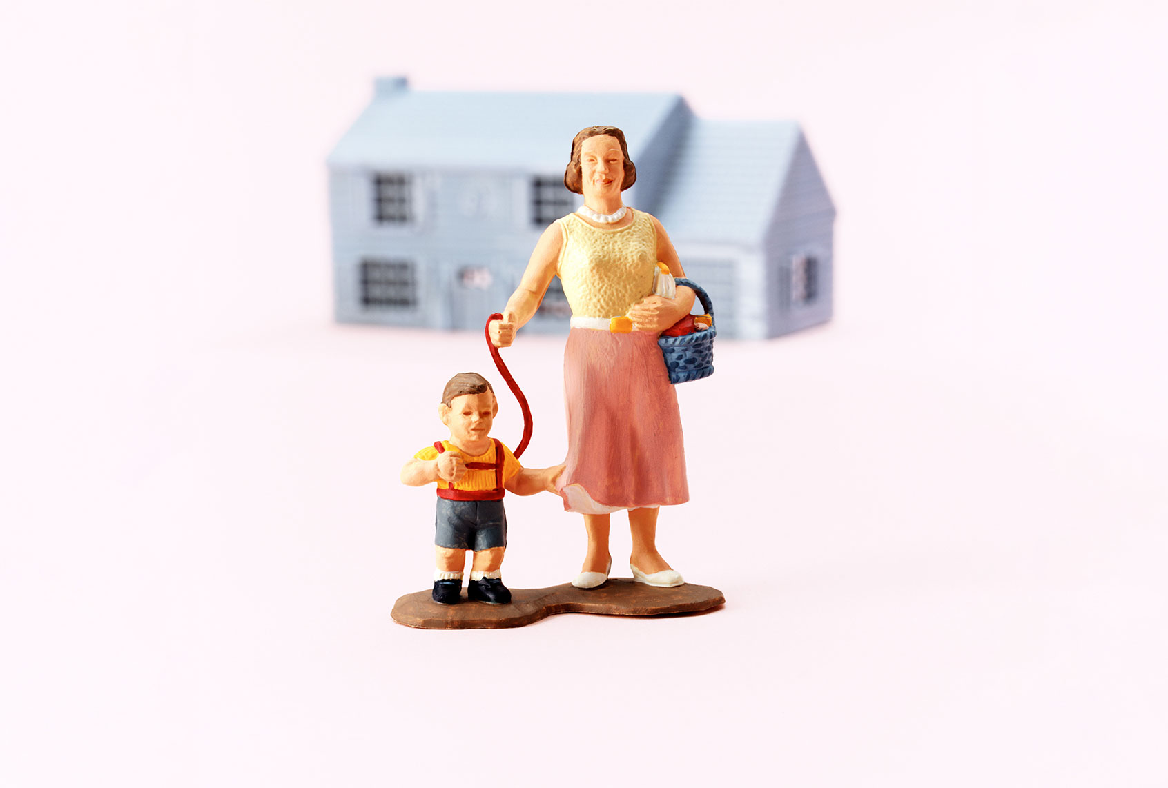 Woman with Child on Leash (Getty Images)