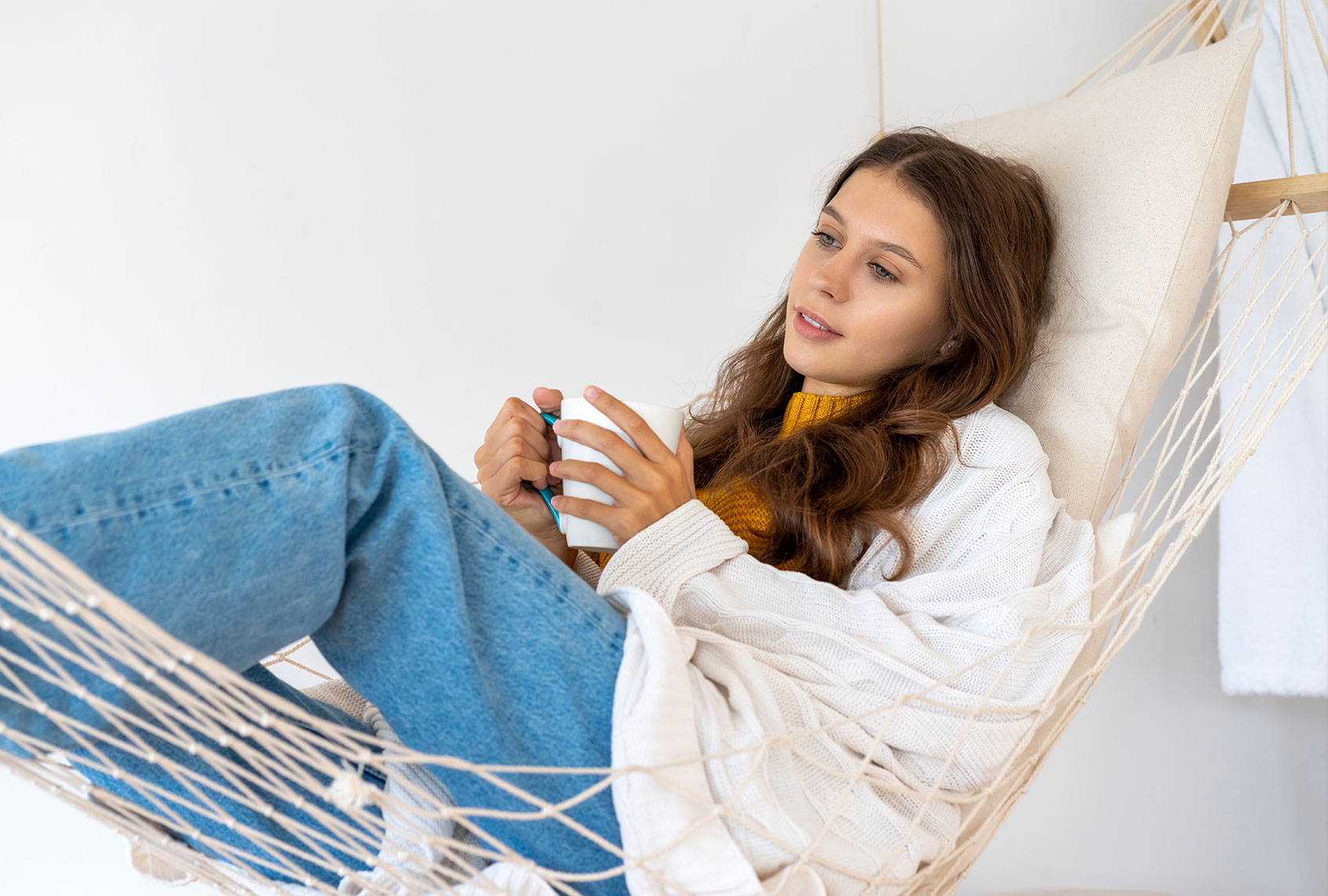 Woman drinking hot beverage and enjoying morning (Getty Images)