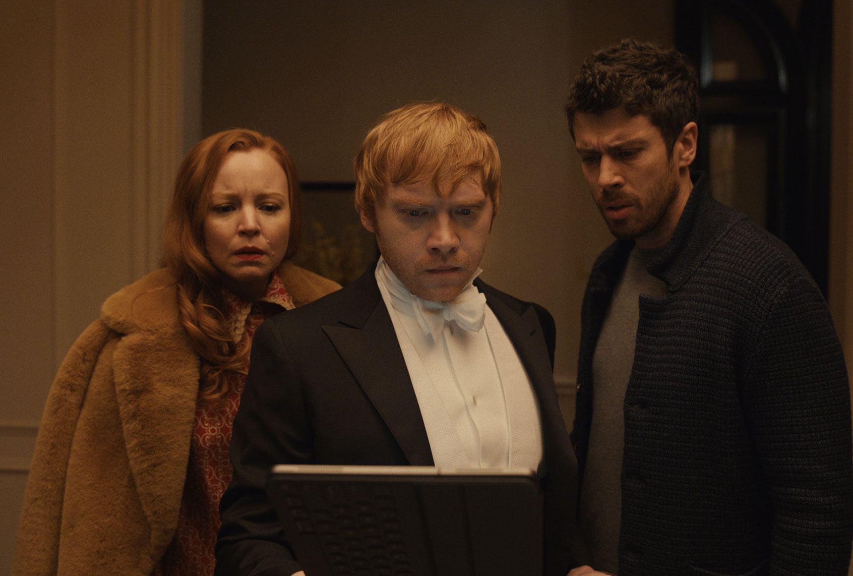 Lauren Ambrose, Rupert Grint and Toby Kebbell in “Servant” (Apple TV+)