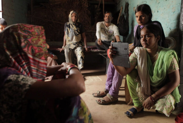 Meera, Chief Reporter for news outlet Khabar Lahariya filming an interview in India’s Uttar Pradesh region in "Writing With Fire" (Black Ticket Films)