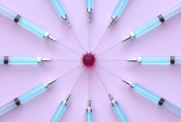 Digital generated image of circular pattern made out of Syringes with COVID-19 vaccine targeting into coronavirus cell (Getty Images)
