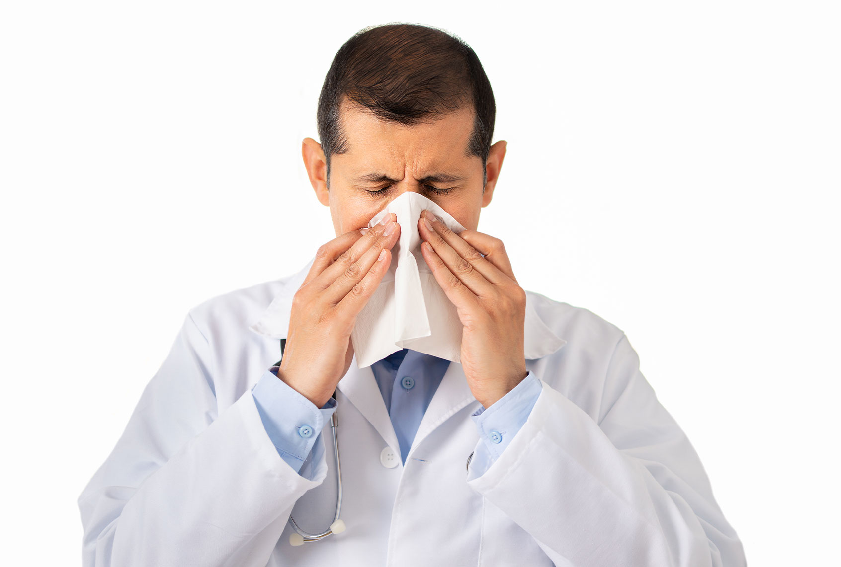 Doctor blowing his nose (Getty Images)