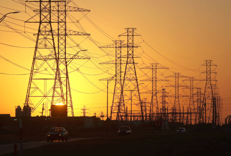 A view of high voltage transmission towers on February 21, 2021 in Houston, Texas. Millions of Texans lost their power when winter storm Uri hit the state and knocked out coal, natural gas and nuclear plants that were unprepared for the freezing temperatures brought on by the storm. Wind turbines that provide an estimated 24 percent of energy to the state became inoperable when they froze. (Justin Sullivan/Getty Images)