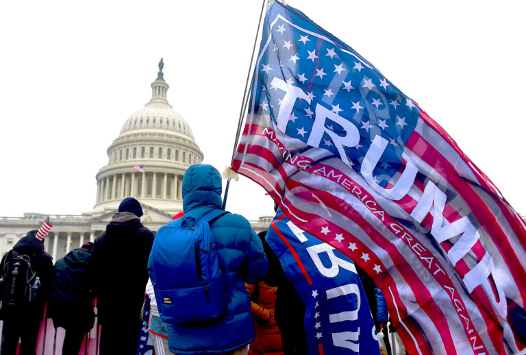 Supporters of US President Donald Trump hold a rally outside the US Capitol as they protest the upcoming electoral college certification of Joe Biden as US President in Washington, DC on January 6, 2021. (OLIVIER DOULIERY/AFP via Getty Images)
