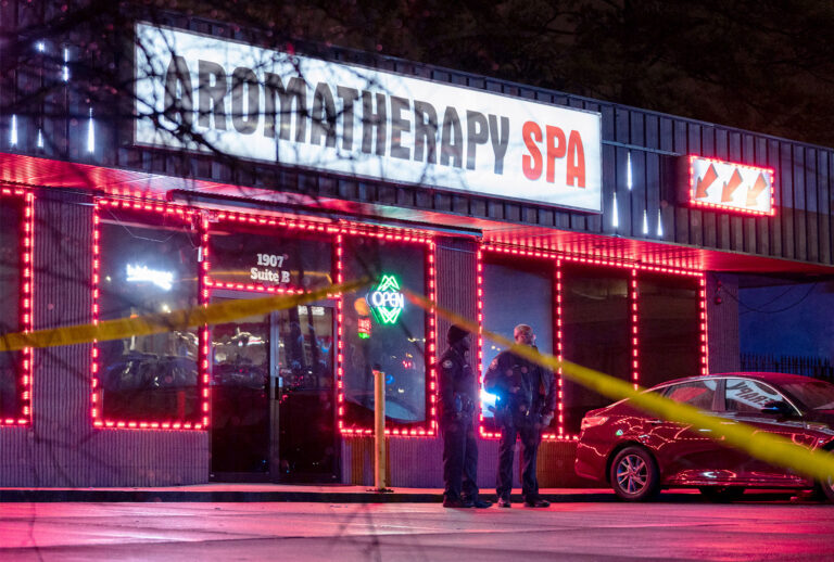 Law enforcement personnel are seen outside a massage parlor where a person was shot and killed on March 16, 2021, in Atlanta, Georgia. - Eight people were killed in shootings at three different spas in the US state of Georgia on March 16 and a 21-year-old male suspect was in custody, police and local media reported, though it was unclear if the attacks were related. (ELIJAH NOUVELAGE/AFP via Getty Images)