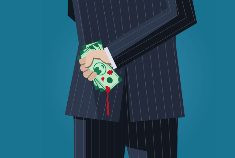 Business man with bloody money behind his back (Getty Images)