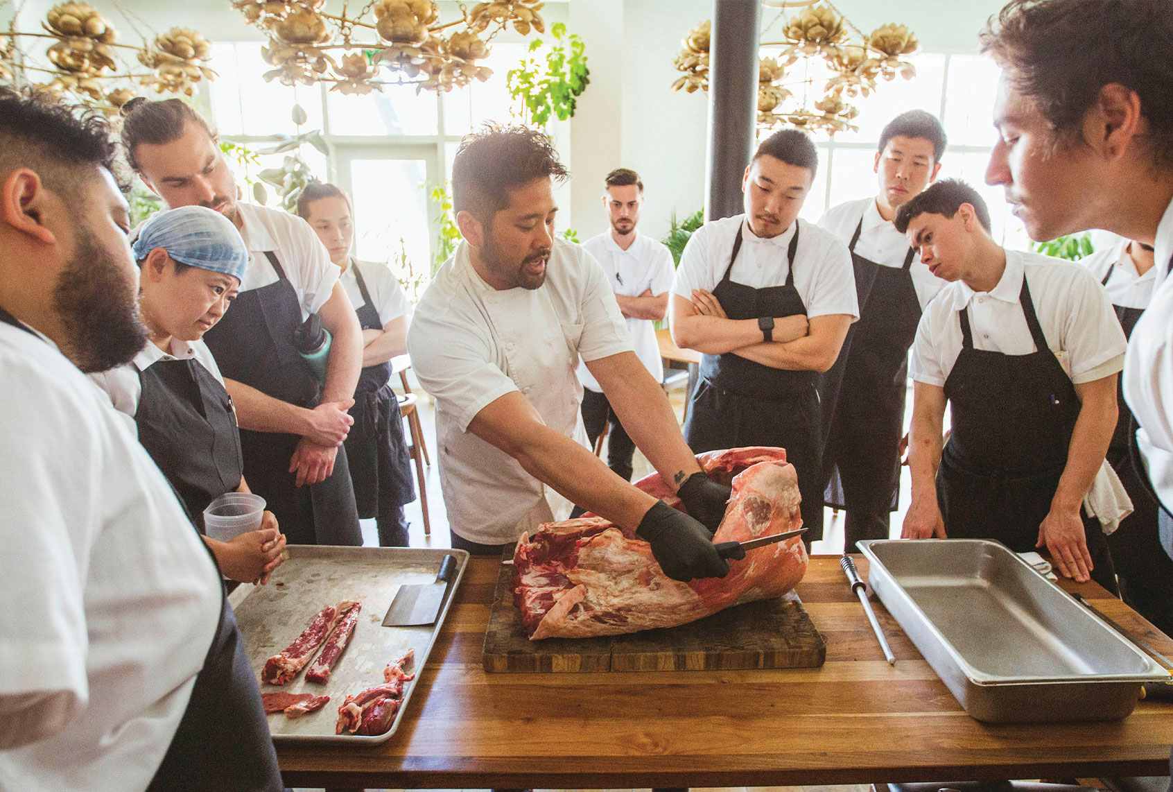 Brandon Jew, center, is the chef behind the Michelin-starred Mister Jiu’s restaurant in San Francisco. (Penguin Random House)