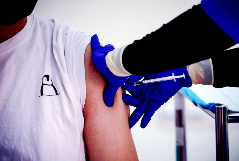 A healthcare worker receives a dose of Pfizer-BioNTech Covid-19 vaccine (Wong Fok Loy/SOPA Images/LightRocket via Getty Images)