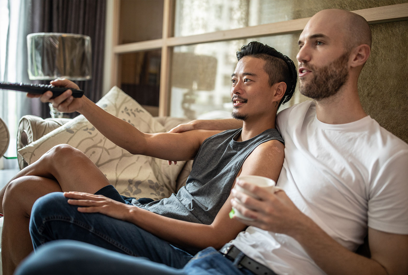 Couple watches TV at home (Getty Images)