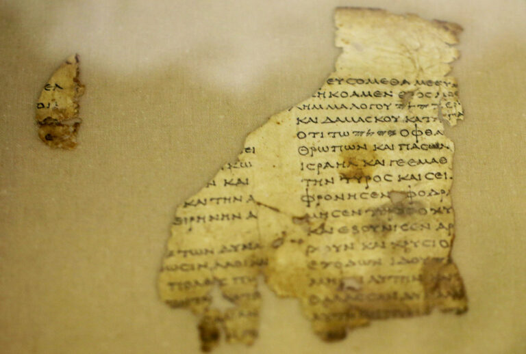 Fragments of the new discovered Dead Sea Scroll are seen in a lab in the Israel Museum in Jerusalem on March 16, 2021. Israeli archaeologists have discovered dozens of fragments of a biblical scroll written in Greek in the Cave of Horror near the Dead Sea. (Xinhua/Muammar Awad via Getty Images)