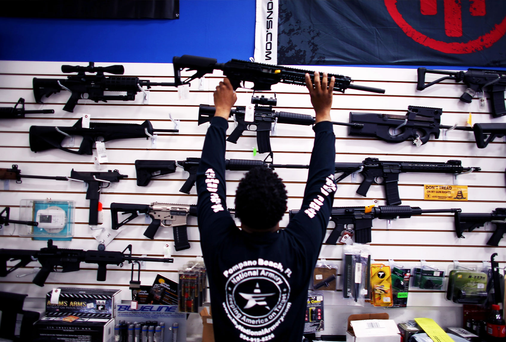 An employee puts a weapon on display at the National Armory gun store on April 11, 2013 in Pompano Beach, Florida. (Joe Raedle/Getty Images)