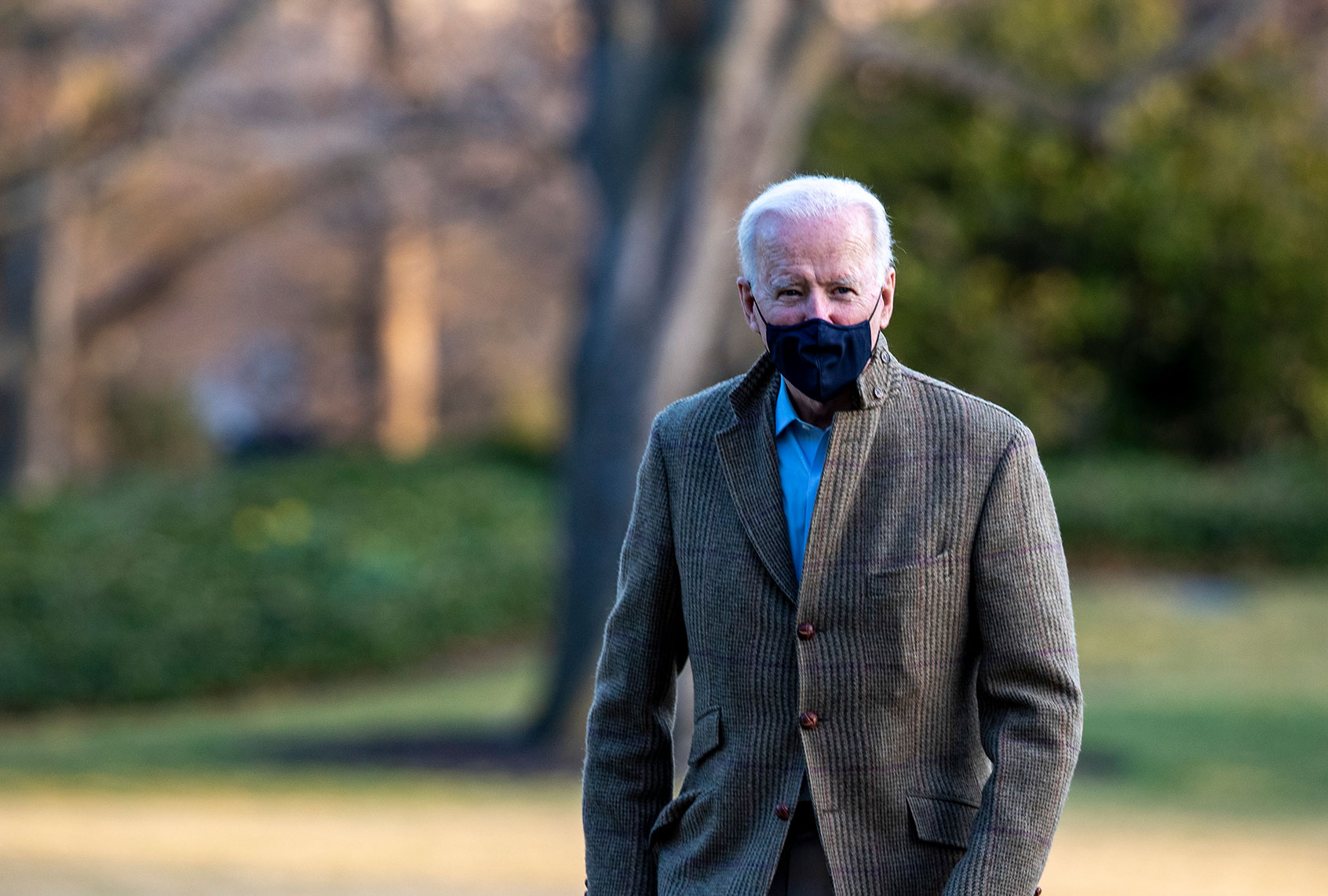U.S. President Joe Biden stops to talk to the media after stepping off Marine One on the South Lawn of the White House on March 14, 2021 in Washington, DC. President Biden and First Lady Dr. Jill Biden were traveling from Wilmington, Delaware, where they spent the weekend with family and friends. (Tasos Katopodis/Getty Images)