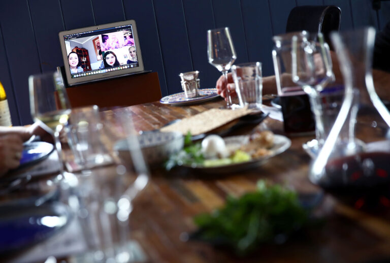 Sarah and Aaron Sanders celebrate a Passover Seder with their children, Noah, 19, Bella, 18 and Maya, 13, at home and different family members across the country via video conference on April 08, 2020 in San Anselmo, California. Many families are turning to video conference to celebrate Passover Seders because of the coronavirus (COVID-19). (Ezra Shaw/Getty Images)
