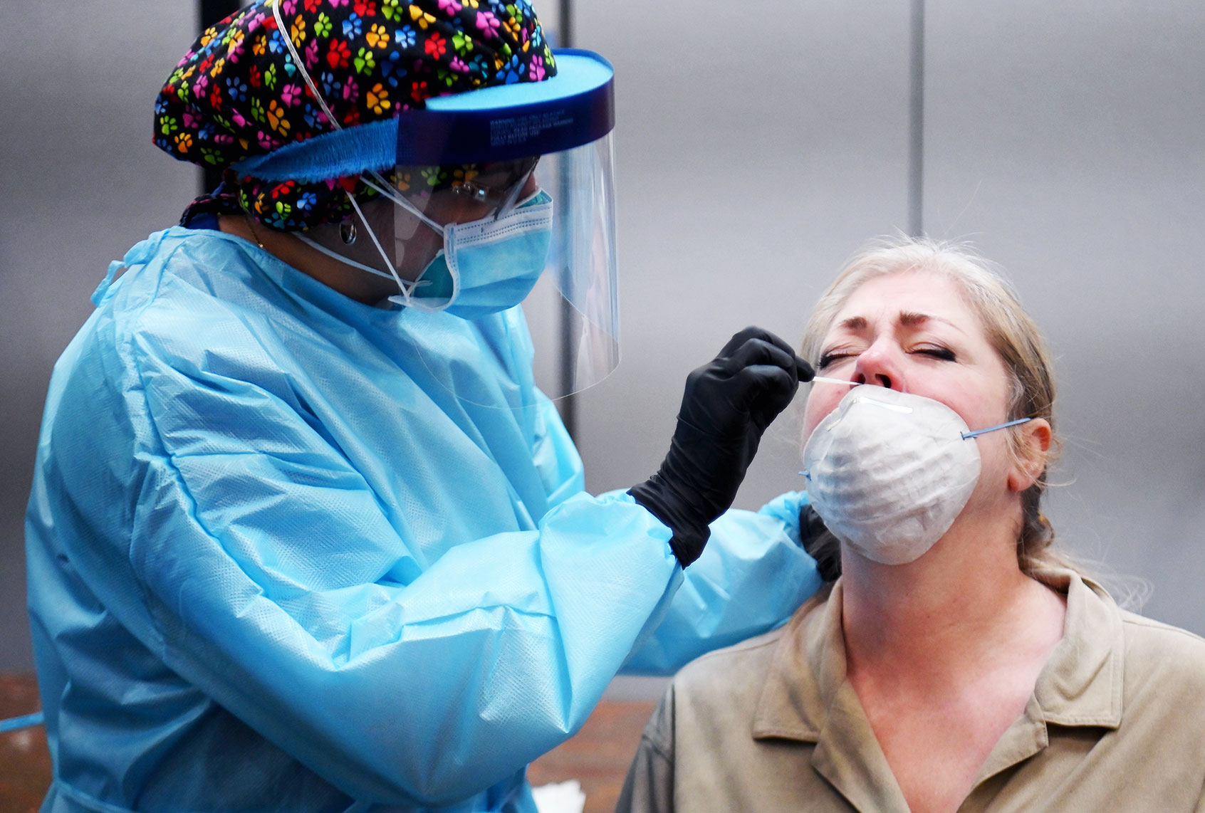 A healthcare worker takes a nasal swab sample from a resident to test for COVID-19 at The Abyssinian Baptist Church in the Harlem neighborhood of New York City on May 13, 2020. (ANGELA WEISS/AFP via Getty Images)