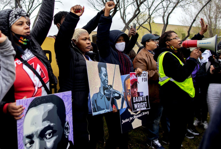 Activist Nola Darling talks on the megaphone in front of the Brooklyn Center police station at a protest over the police killing of Daunte Wright in Brooklyn Center, Minnesota, U.S., on April 13, 2021. (Christopher Mark Juhn/Anadolu Agency via Getty Images)