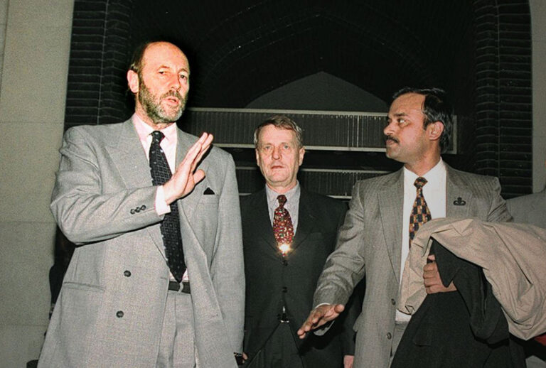 United Nation's Humanitarian Coordinator in Iraq, Denis Halliday (L), walks with UN chief Kofi Annan's special assistant Shashi Tharoor of India, Annan's political advisor Rolf Knutsson of Sweden (2nd L) and the head of the Iraqi foreign ministry protocol, Qais al-Karkhi, 19 February in Baghdad. Annan sent a UN advance team to Iraq ahead of a last-ditch effort to end a standoff over weapons inspections and avert a military strike. (KARIM SAHIB/AFP via Getty Images)