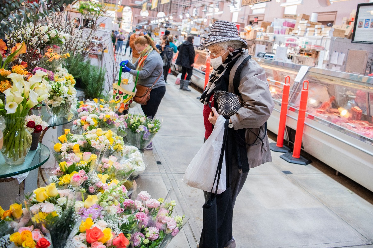 Shoppers and grocers in Eastern Market. (Photo By Tom Williams/CQ-Roll Call, Inc via Getty Images)