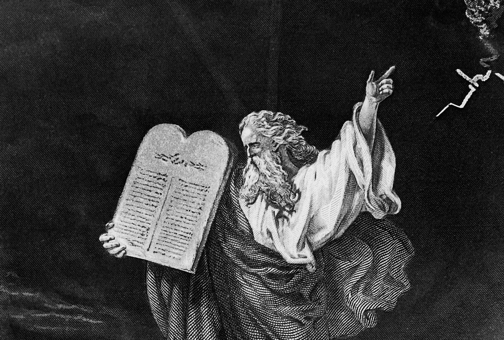 Moses carrying Ten Commandments down Mount Sinai (Getty Images)